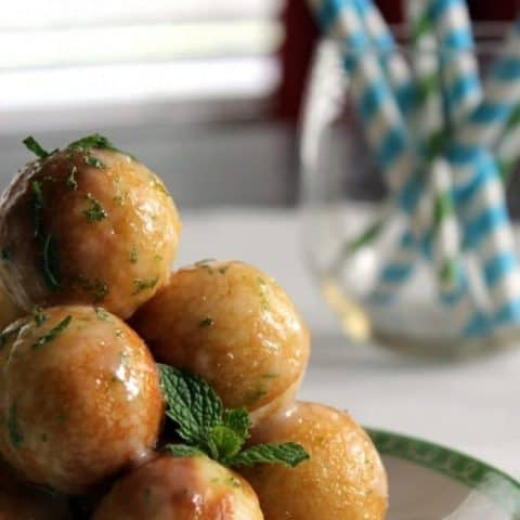 close up of Moscow Mule Doughnut Holes on a white plate