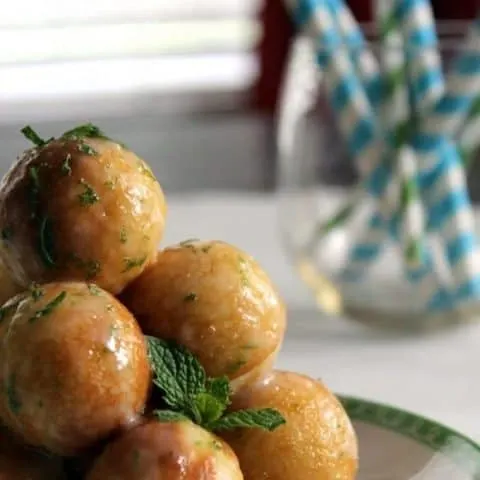 close up of Moscow Mule Doughnut Holes on a white plate