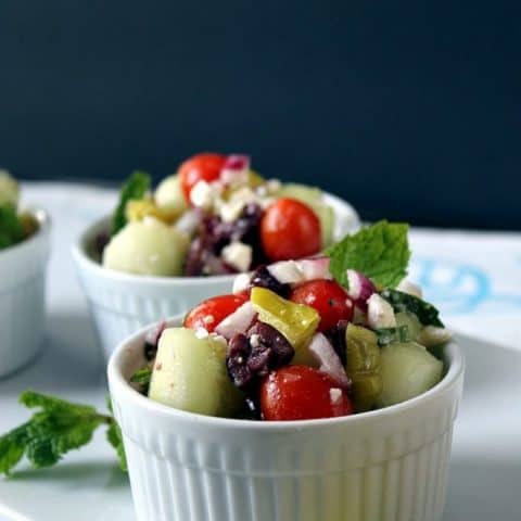 Bite-Sized Greek Salad on a white platter