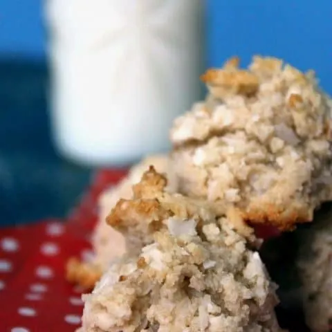 close up of Coconut Vanilla Macaroons stacked on a red napkin