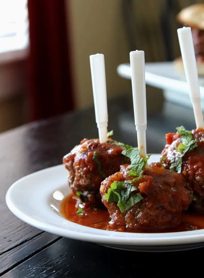 close up of Juicy Mediterranean Lamb Meatballs on a white plate