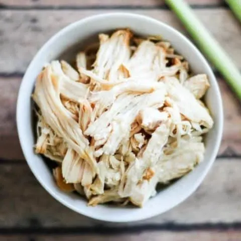 Overhead of lemongrass chicken in a white bowl