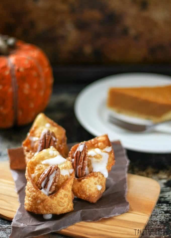 Close up of the chocolate pumpkin wontons on a wood serving board