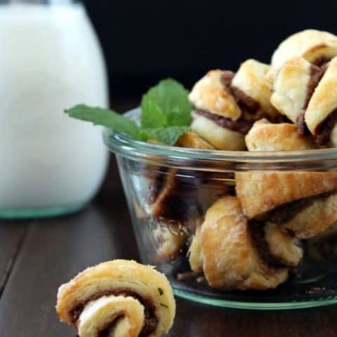Nutella Mint Rugelach in a glass bowl and one on the table