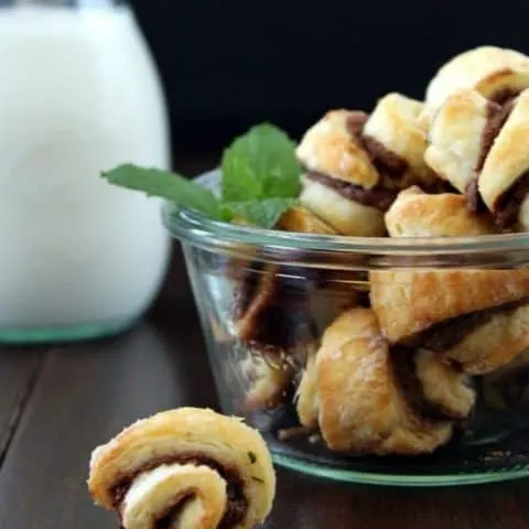 Nutella Mint Rugelach in a glass bowl and one on the table