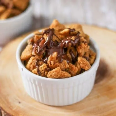 Crack Chex mix in a white bowl