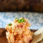 Creamy, cheesy Pimento Cheese Spread is a great party spread! You can make it ahead of time, it keeps for a few days - if it lasts that long, and you can serve it in a bowl or roll it into a cheese ball and sprinkle with toasted pecans! Serve with crackers or on a burger! Pimento Cheese Spread Recipe | Take Two Tapas | #PimentoCheese #Spreads #Cheese #Pimento #MothersDay #Easter