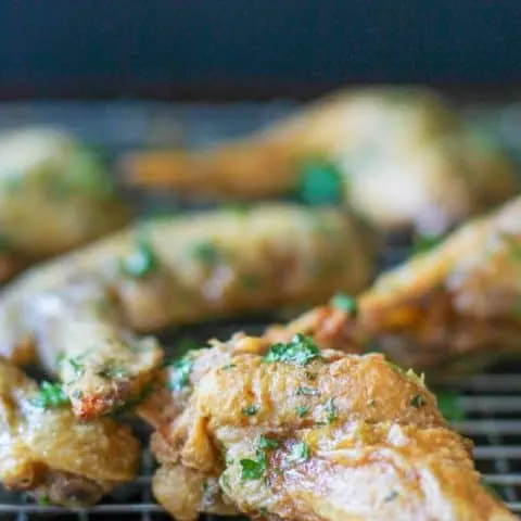 No sauce Crispy Green Herb Chicken Wings on a baking rack