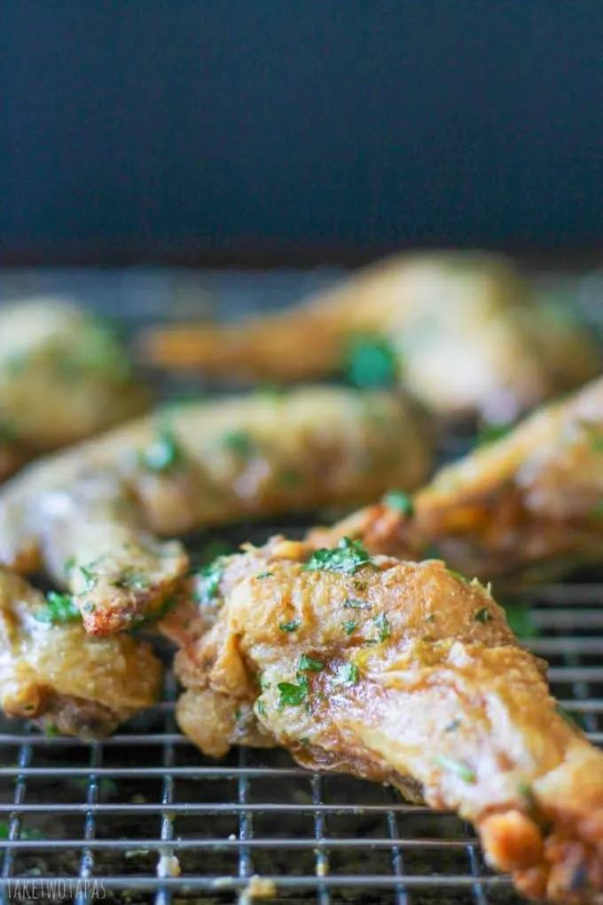 No sauce Crispy Green Herb Chicken Wings on a baking rack