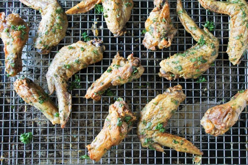 Overhead of Green Herb chicken wings on a wire rack