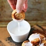 These mini cinnamon roll bites are quickly made with the help of puff pastry. Sprinkled with brown sugar and baked until golden brown, they are crispy on the outside and flaky on the inside. Top them off with vanilla glaze for the perfect bite! Mini Puff Pastry Cinnamon Rolls Recipe | Take Two Tapas | #PuffPastry #CinnamonRolls #Breakfast #Mini #Breakfast
