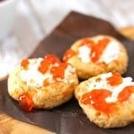 Who knew that cookies could be savory? I did! These cheesy, flaky cookies are full of flavor and spice and with creamy goat cheese on top with a sweet and spicy pepper jelly, they are the perfect bite! Spicy Cheese Thumbprints with Goat Cheese and Hot Pepper Jelly Recipe | Take Two Tapas