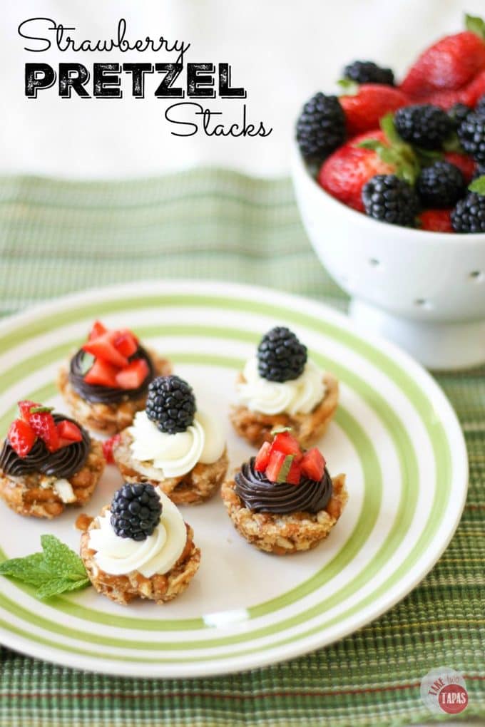 Take out the cream cheese and the jello and make these tiny bites with a crispy pretzel crust, creamy chocolate ganache, and fresh strawberries and mint! Strawberry Pretzel Stacks Recipe | Take Two Tapas | #Strawberry #Pretzel #Stacks #Jello #Salad