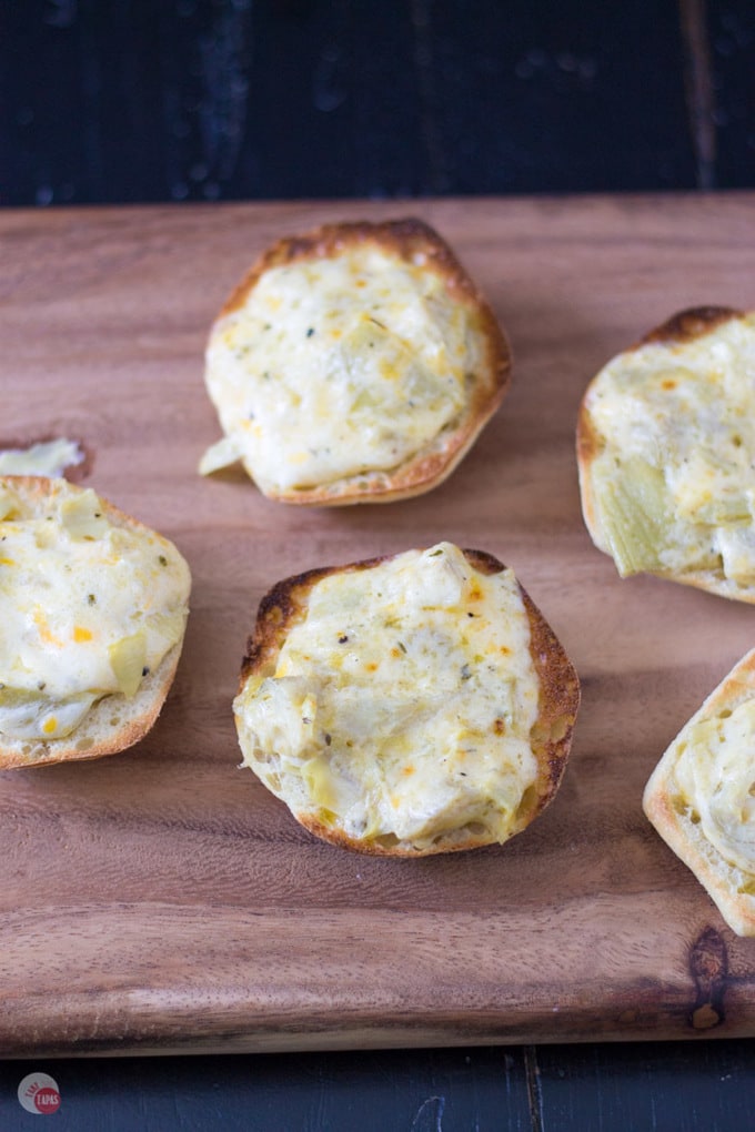 Roasted garlic and tangy marinated artichokes on Garlic Artichoke Cheese Toasts Recipe | Take Two Tapas | #GarlicBread #Artichokes #Garlic #Toasts #CheeseToastRecipe