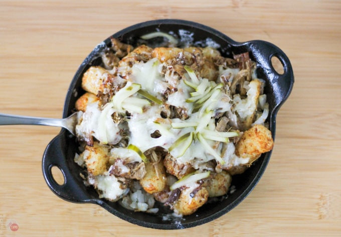 Overhead close up of Cuban Totchos Nachos in a cast iron pan