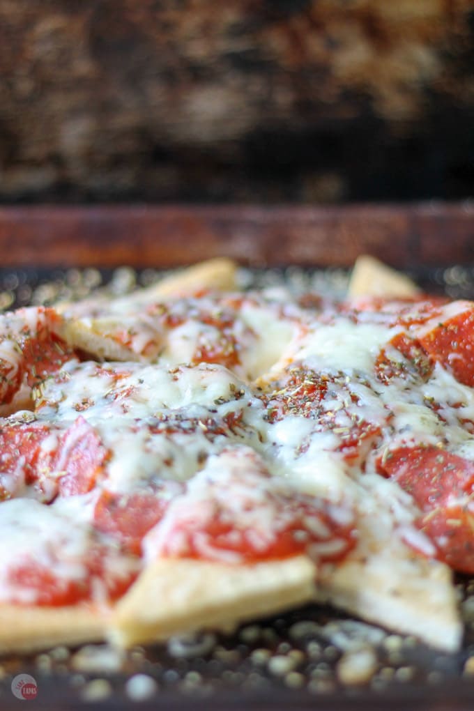 Your favorite pepperoni pizza is now nachos! | Take Two Tapas | #Pizza #Nachos #PizzaNachos #GameDay #MarchMadness