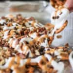 Pretzel Dessert Nachos are a new twist on a savory favorite. Salty pretzels used as chips and topped with peanut butter, marshmallow cream, chocolate chips, and buttery toasted pecans. Pretzel Dessert Nachos Recipe | Take Two Tapas