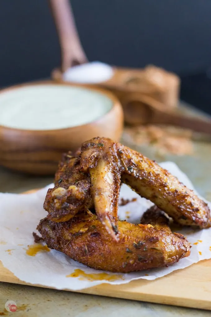 jerk seasoned chicken wings on a cutting board