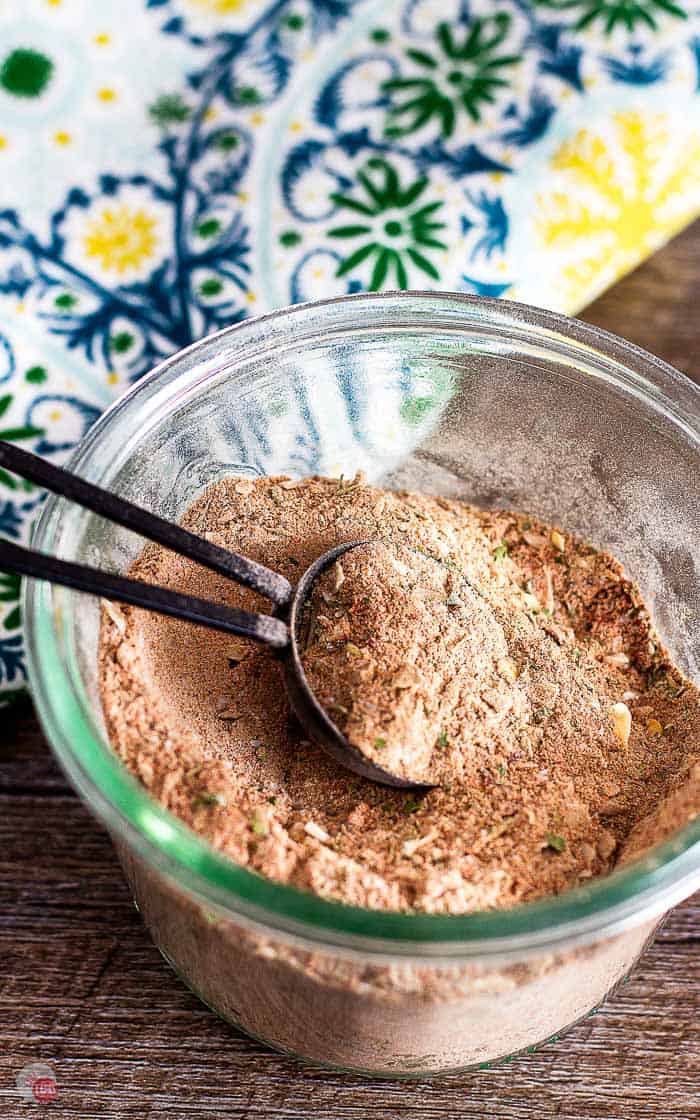 small bowl of jerk seasoning with a measuring spoon