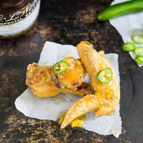 overhead shot of Oven Baked Sweet and Spicy Chicken Wings on a white napkin