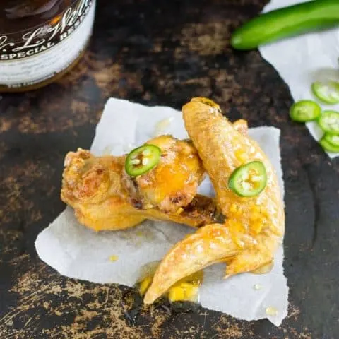 overhead shot of Oven Baked Sweet and Spicy Chicken Wings on a white napkin