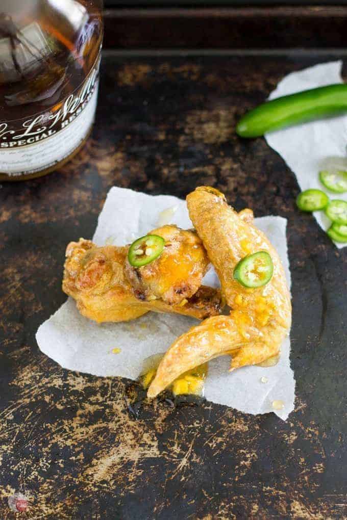 overhead shot of Oven Baked Sweet and Spicy Chicken Wings on a white napkin