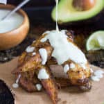 Crispy oven-baked chicken wings marinated in homemade Southwest Seasoning Mix are a great addition to any party! Serve with an Avocado Salsa Verde sauce to cool them down! Southwest Chicken Wings Recipe | Take Two Tapas | #Southwest #TacoSeasoning #ChickenWings #SouthwestChickenWings #ChickenWingRecipe #ChickenWingFlavors