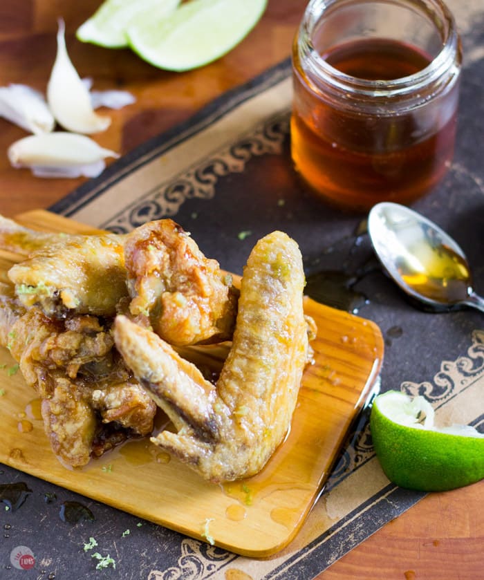 Garlic honey lime chicken wings on a cutting board