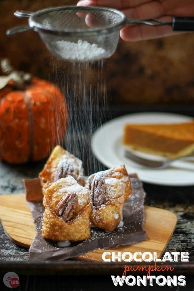 Delicious Crispy Chocolate Pumpkin Wontons on a wood serving board