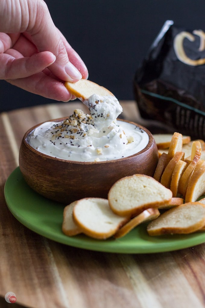a bowl of everything bagel dip with chips