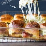 All the yummy ham, pineapple, and all that stretchy cheese! Hawaiian Pizza Sliders Recipe | Take Two Tapas | #HawaiianPizza #Hawaiian #pizza #Sliders #PartyFoods #makeaheadmeals #kidfriendly
