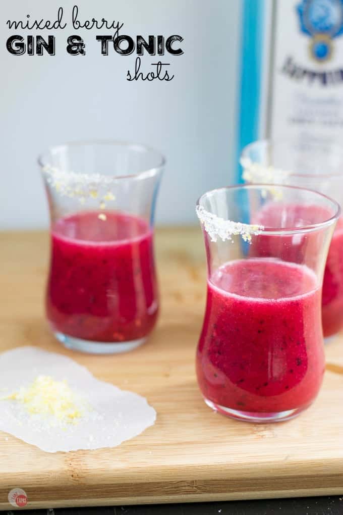 Pin image of 3 shot glasses a bottle of liquer with text "mixed berry gin & tonic shots"