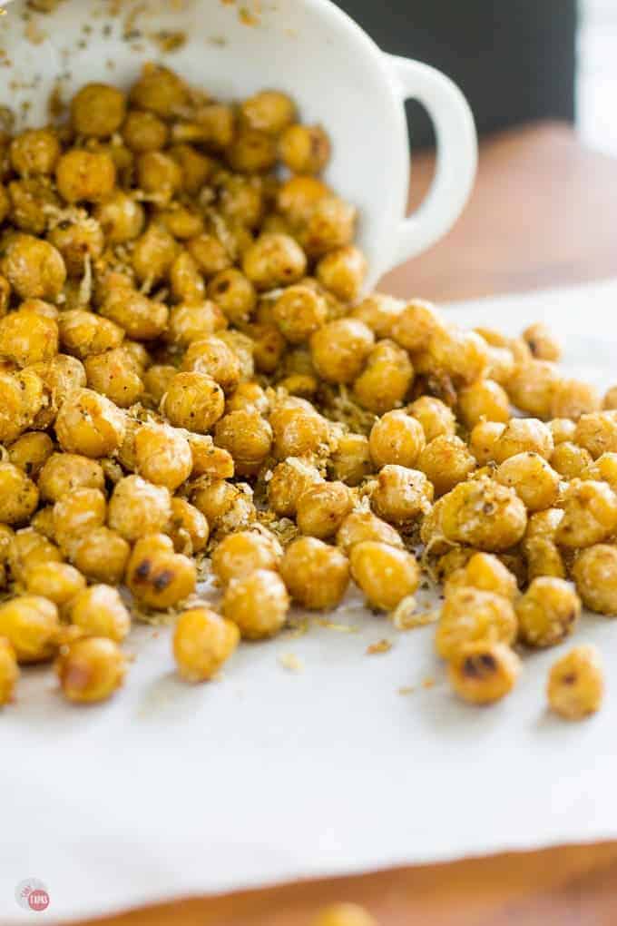 Close up of Pan Roasted Chickpeas spilling on parchment paper