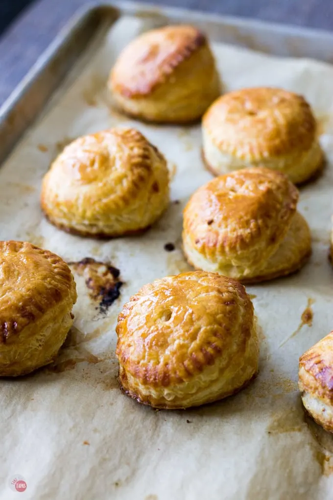 Leftover smoked chicken and few remaining grapes and make it into hand pies for lunch or your next tailgating party! Smoked Chicken and Roasted Grape Hand Pies Recipe | Take Two Tapas | #SmokedChicken #ChickenRecipes #LeftoverRecipe #LeftoverChicken #HandPies #PuffPastry #grapes