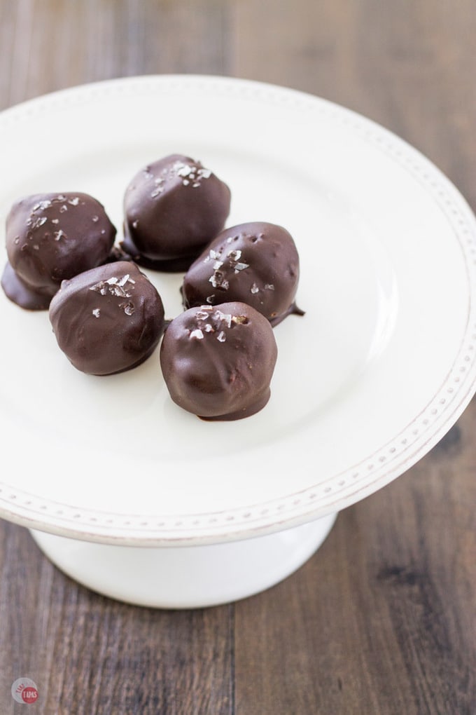 Cracker truffles with peanut butter and honey on a white platter