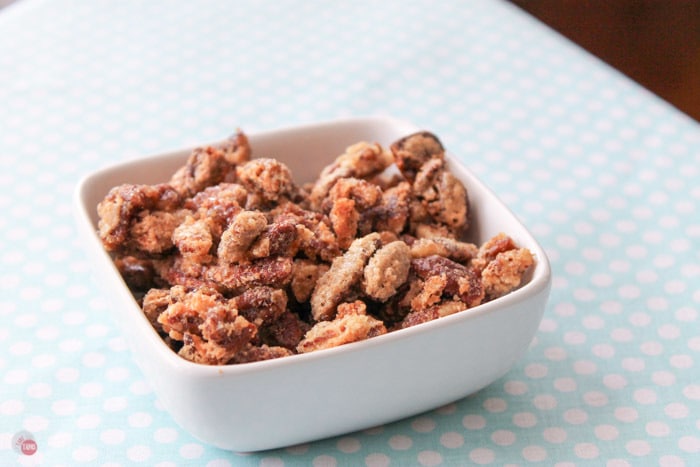 sugar coated pecans in a white bowl