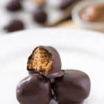 Creamy Dulce de Leche meets a salty cracker and fall in love. They drink to their love with Fireball whiskey and swim in some chocolate to complete their date! Dulce de Leche Fireball Truffles Recipe | Take Two Tapas | #Truffles #DulcedeLeche #Crackers #Fireball #Whiskey #DarkChocolate #TruffleRecipe #SmallSweets