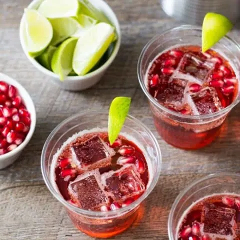 Overhead of cups filled with with pomegranate ginger ale sparkler