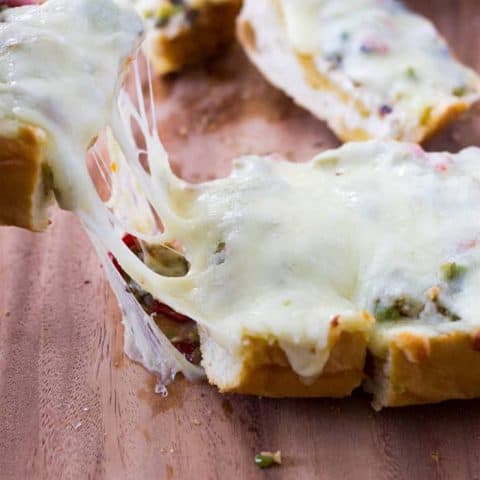 Pulling the cheesy olive bread apart