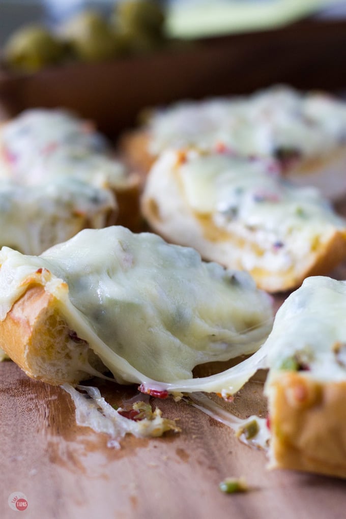 This Cheesy Olive Salad Bread will warm your heart and guests!