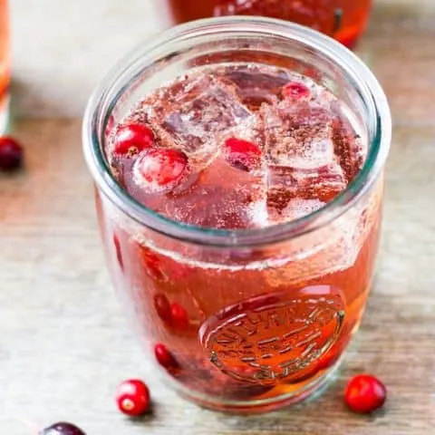 Roasted cranberry bourbon crush in a glass
