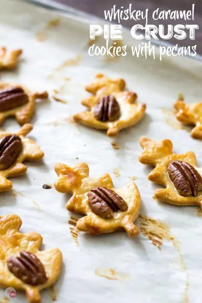 Pie crust cookies on parchment paper and text "whiskey caramel pie crust cookies with pecans"