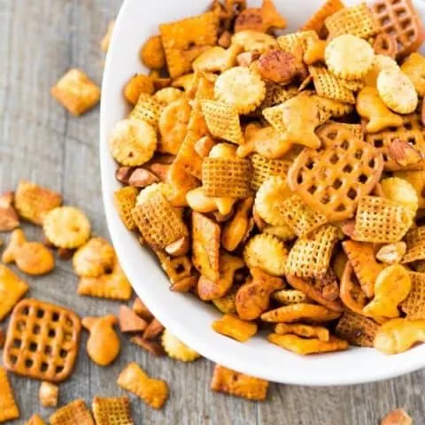 snack mix in a bowl and on the table
