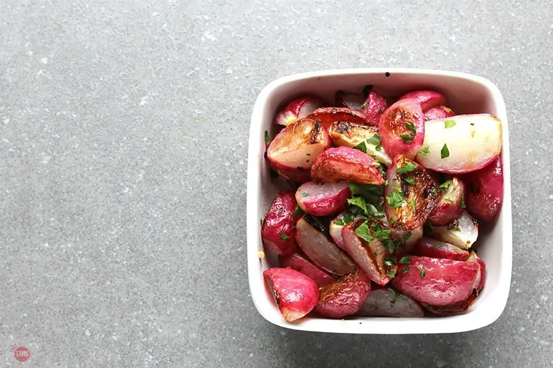 overhead of Crispy Garlic Radishes in a white bowl