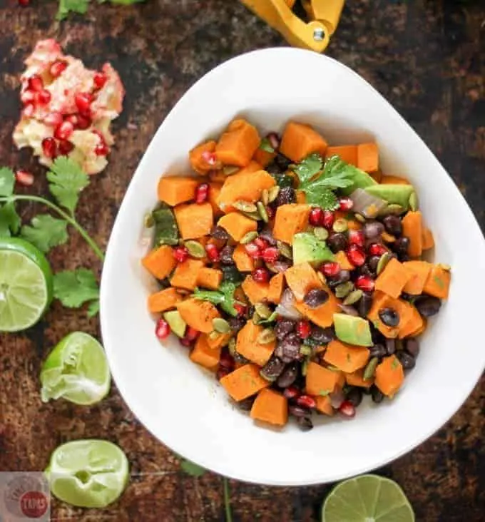 Overhead of Sweet potatoes, black beans, and avocado in a white bowl