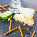 Margarita Bars have a creamy and tart lime filling complete with a splash of tequila that sits atop a shortbread salty pretzel crust. | Take Two Tapas | #MargaritaBars #Margarita #LemonBars #CincoDeMayo