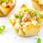 These Mexican Street Corn Wonton Salad Cups are the bomb! Roasted corn combined with jalapeno, red onions, sour cream, Cojita cheese, and some chili powder for spice makes a great party appetizer or side dish. Mexican Street Corn Wonton Salad Cups Recipe | Take Two Tapas | #MexicanStreetCorn #Salad #Wonton #StreetCorn #CincodeMayo