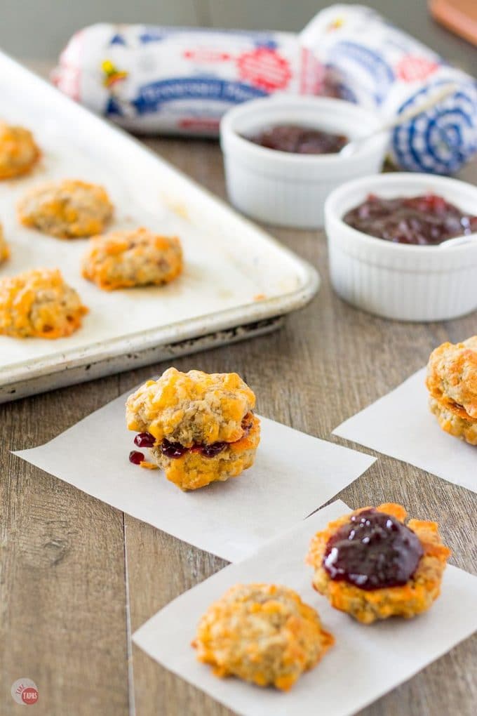 Sausage ball sliders with jelly filling are a great way to change up your breakfast routine! It's Spring so that means turning over a new leaf and setting some new breakfast goals. Make a change along with the season and start your day off with a change in your breakfast! Sausage Ball and Jelly Breakfast Sliders | Take Two Tapas