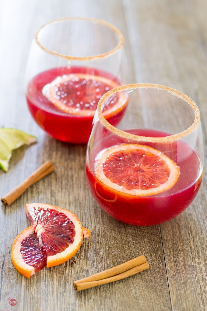 side view of margaritas on a wood surface