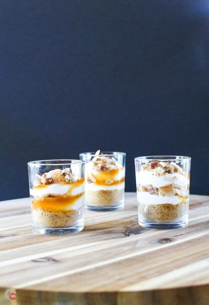 These Cream Caramel Shooters are filled with fluffy cream cheese, whipped topping, caramel sauce, and toasted coconut! Make these ahead of time and wow your party guests!
